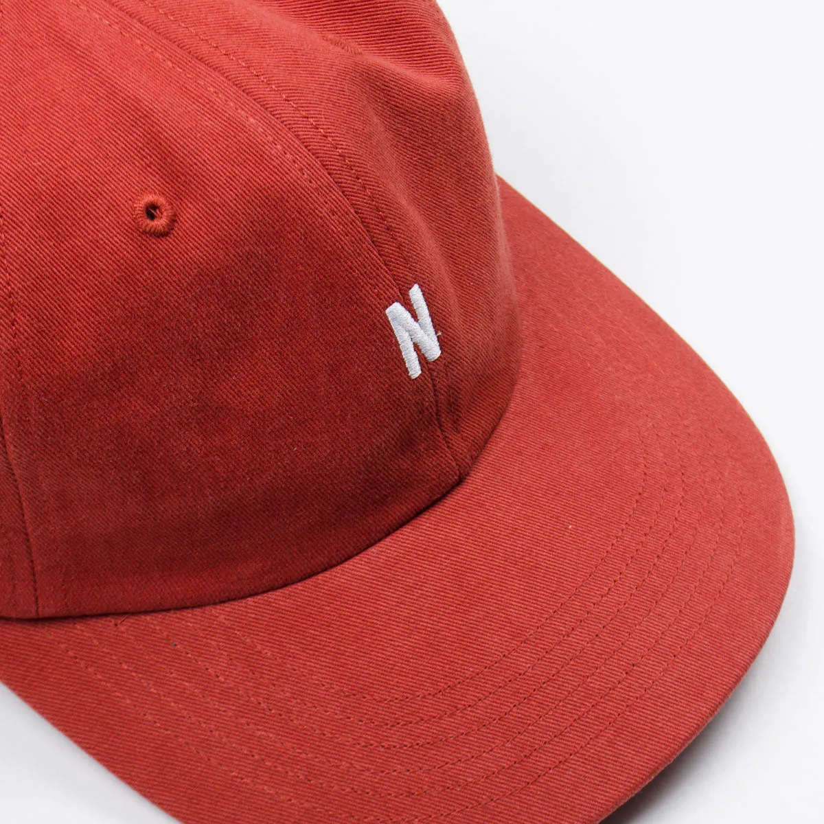 Norse Projects Twill Sports Cap in Industrial Orange.