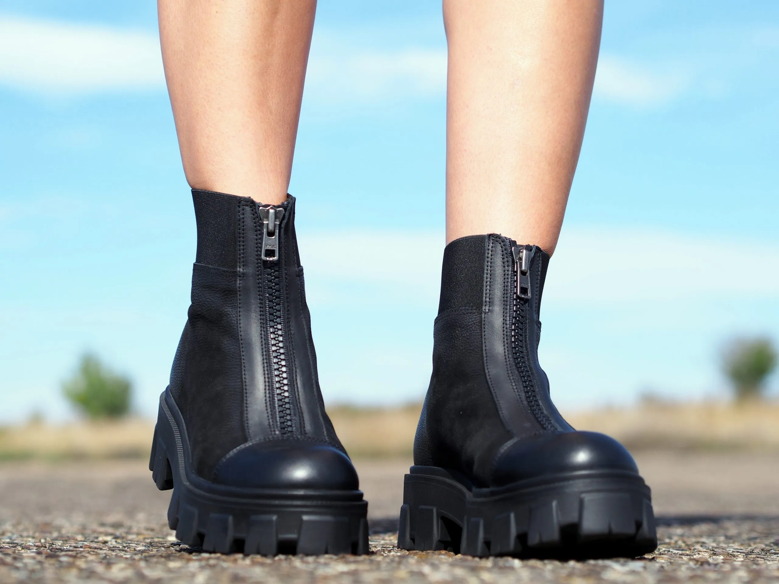 Women's black genuine leather boots, extravagant winter shoes.