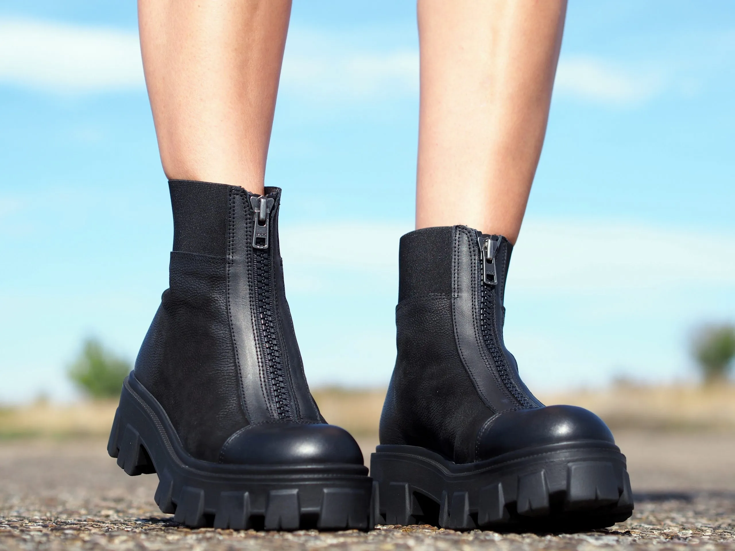 Women's black genuine leather boots, extravagant winter shoes.