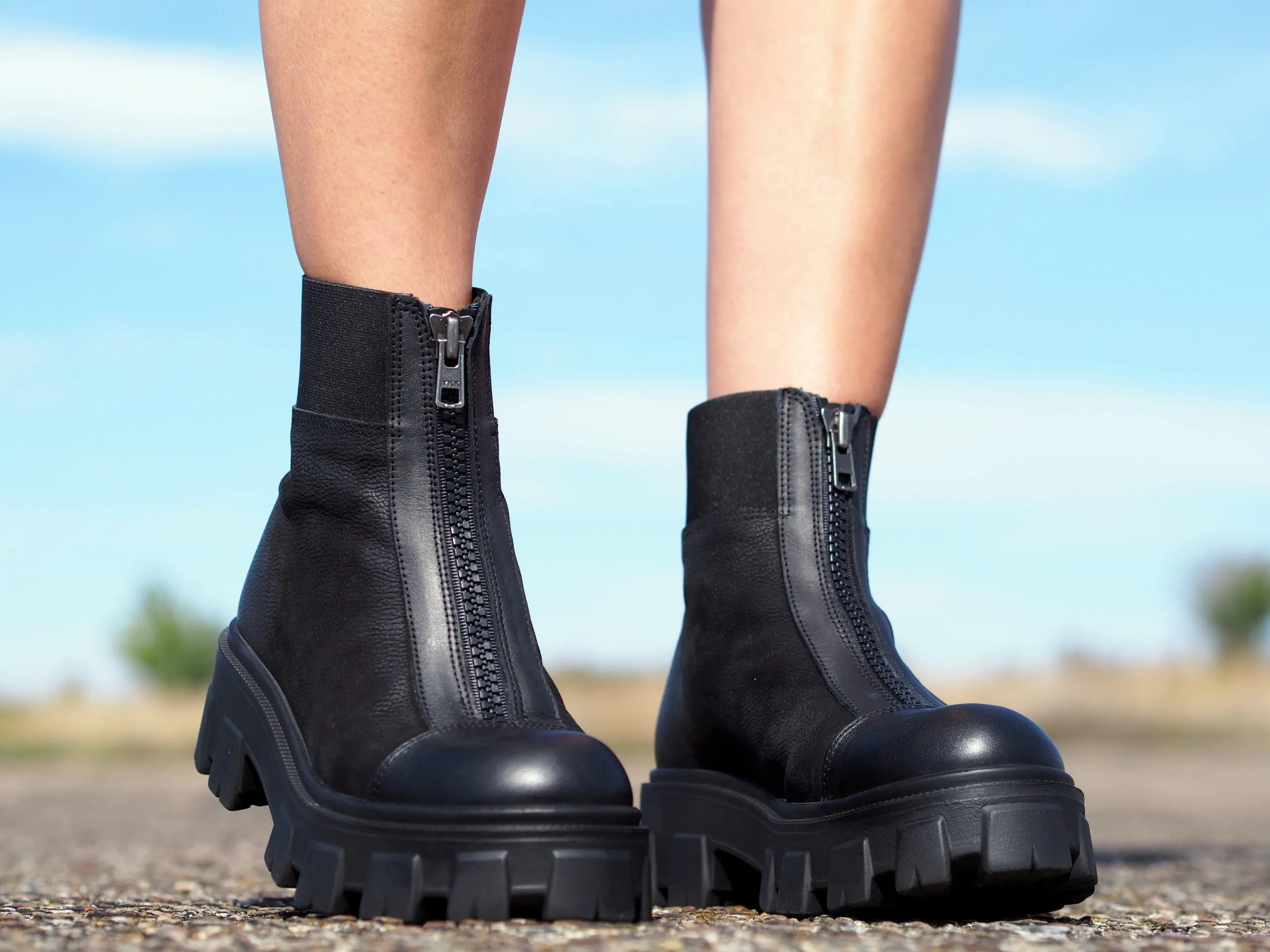 Women's black genuine leather boots, extravagant winter shoes.