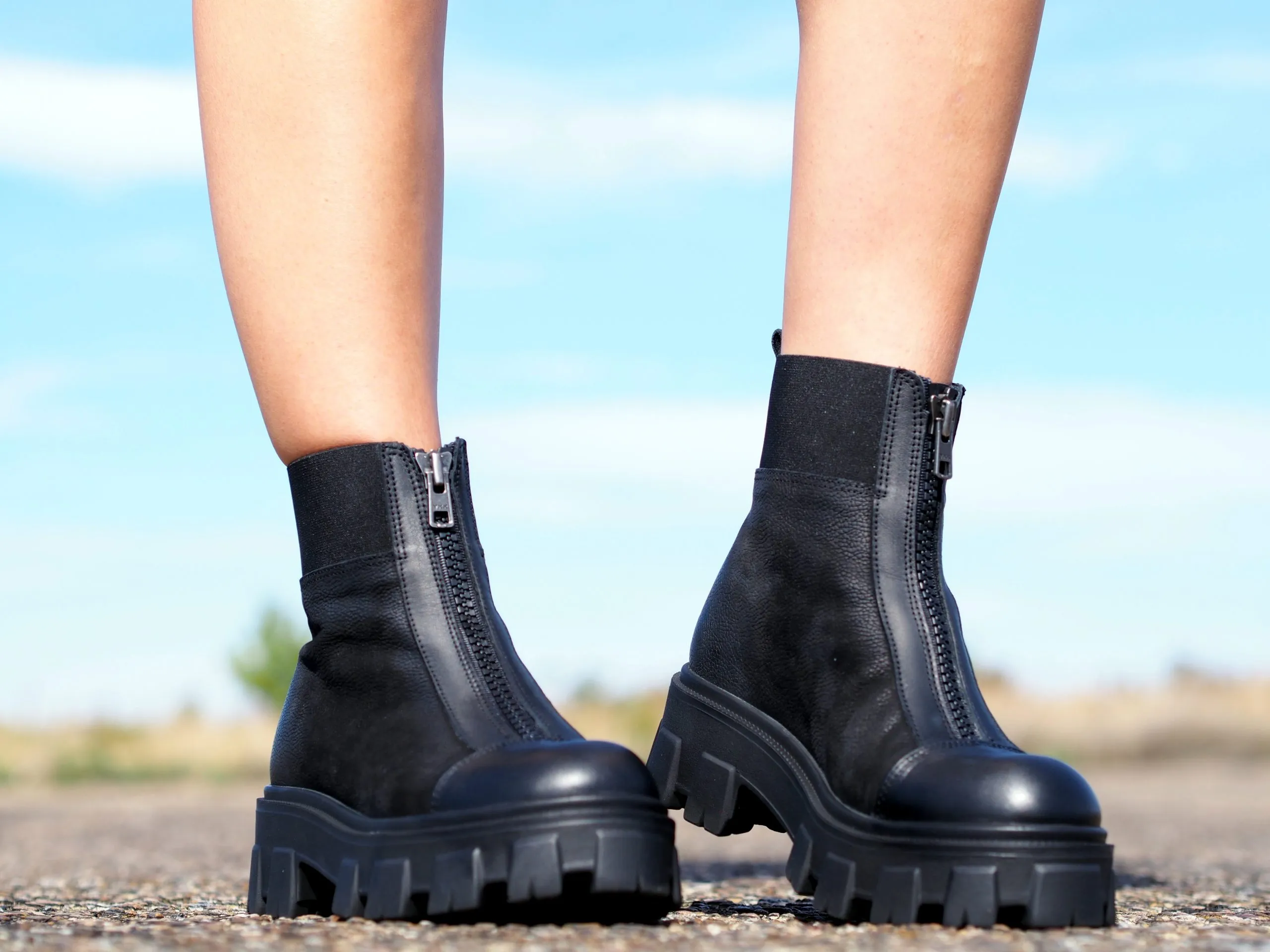 Women's black genuine leather boots, extravagant winter shoes.