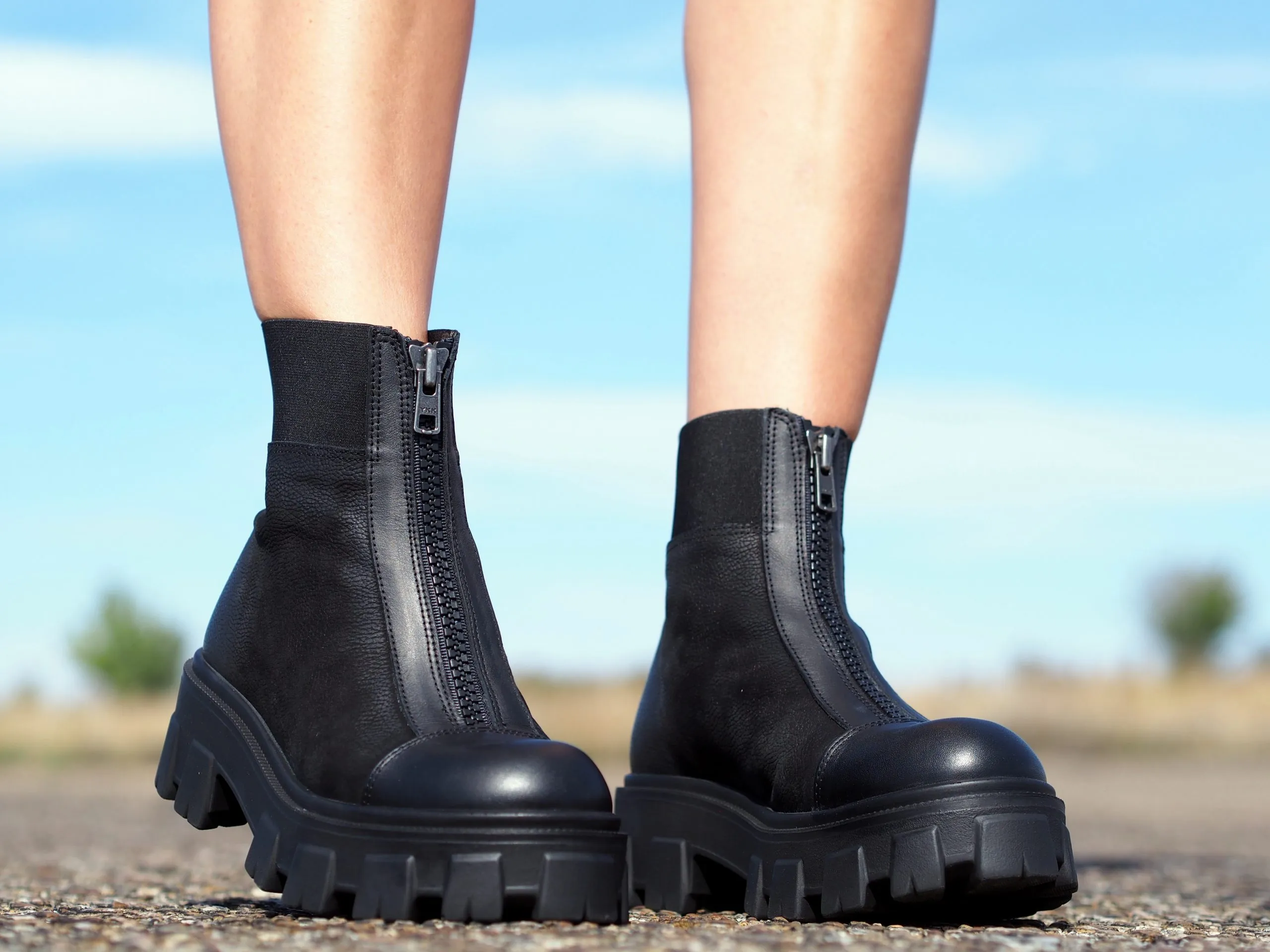 Women's black genuine leather boots, extravagant winter shoes.